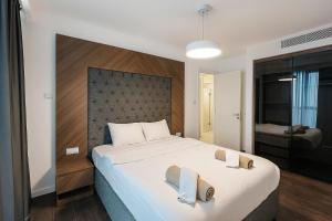 Ένα ή περισσότερα κρεβάτια σε δωμάτιο στο 2Bedroom Apartment in Grand Sapphire Complex Featuring a Pool and Casino