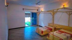 a room with two bunk beds and a window at Farashuu Luna Villas in Nungwi