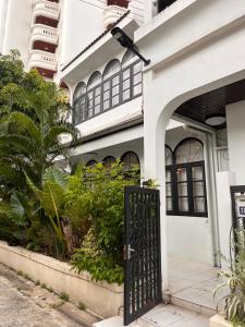an entrance to a building with a black gate at Heart of Phrom Phong in Khlong Toei