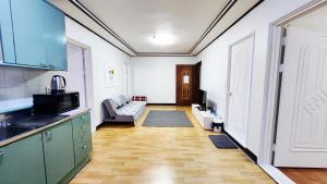 a room with a kitchen and a living room at 반월당 스테이션 #1 in Daegu +5 photos