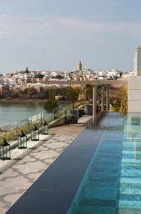 a swimming pool on the roof of a building at Fairmont Residences La Marina Rabat Sale in Rabat