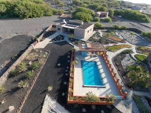 an aerial view of a house with a swimming pool at Vila Babosa in Porto Novo