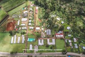 an aerial view of a house with many houses at Kelly's home stay in Goroka