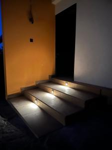 a set of stairs in a room with lights at Lake Breeze Cabana Yala in Tissamaharama +9 photos