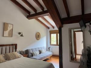 a living room with a couch and a bed at Apartamentos Rurales Valverde in Potes +66 photos