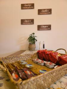 a table with bags of food on a table at Kos central vibes - Casa Vasilis in Kos +4 photos