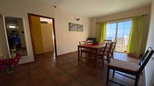 a kitchen and dining room with a table and chairs at Gran Rey n4 in Valle Gran Rey +29 photos