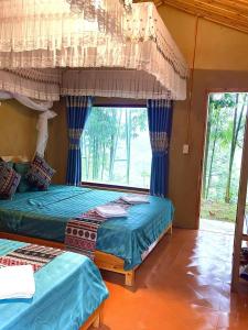 Katil atau katil-katil dalam bilik di Valor Ha Giang Hostel