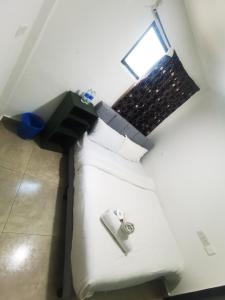 Ένα ή περισσότερα κρεβάτια σε δωμάτιο στο Moonlight Inn Bukit Bintang