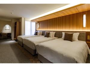 Postel nebo postele na pokoji v ubytování The OneFive Terrace Fukuoka - Vacation STAY 33435v