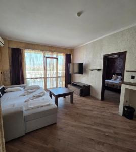 a hotel room with a bed and a fireplace at Art Hotel Babylon in Sunny Beach