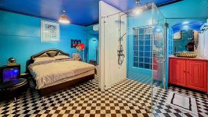 a bedroom with a shower and a bed in a room at The oasis on 8 City blue 2 