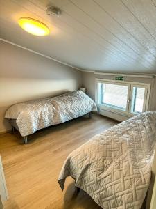 Postel nebo postele na pokoji v ubytování Vuokatti Hideaway by Hilla Villas