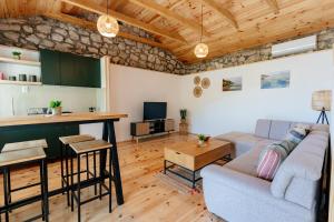 a living room with a couch and a table at Pelican Bay House - Skadar Lake in Krnjice