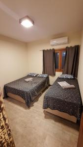 Postel nebo postele na pokoji v ubytování Casa 3 quartos praia do forte poucos metros da praia