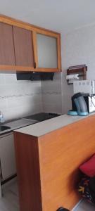 a kitchen with a counter with a phone on it at studio gourette pyrenees 4 pers pied des pistes in Gourette