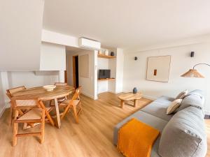 a living room with a couch and a table at Resort house with Pools and Private beach in Tavira