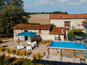an aerial view of a house with a swimming pool at Les Nenuphars - Dordogne, Riberac in Saint-Martial-Viveyrol