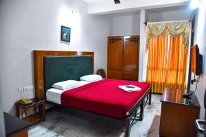 Ένα ή περισσότερα κρεβάτια σε δωμάτιο στο Hotel Grand Palace