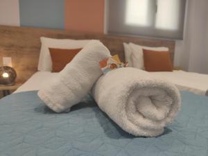 Giường trong phòng chung tại Corfu Port Studios