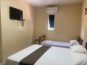 Postel nebo postele na pokoji v ubytování Belo Hotel