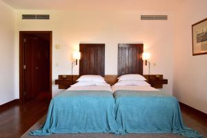 Un pat sau paturi într-o cameră la Pousada Castelo de Alcacer do Sal