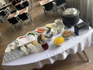 a table with a buffet of food on it at Vaibla Holiday Center in Vaibla