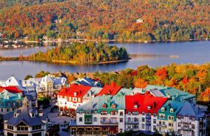 an aerial view of a town on a lake at Le Sous-Bois (Les Manoirs) Mont-Tremblant in Mont-Tremblant