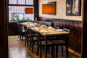 a dining room with a long table and chairs at Loreley Retreat - Sauna-Billiard & more in Sankt Goar