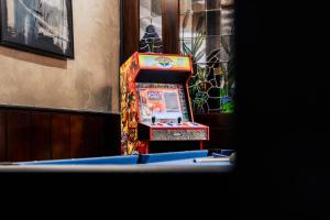 a colorful slot machine sitting next to a building at Loreley Retreat - Sauna-Billiard & more in Sankt Goar