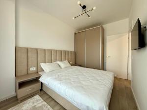 Кровать или кровати в номере Altheda Living Cuza Voda 29-23