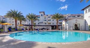 a large swimming pool in front of a large building at The Hideaway in MDR, FREE Parking, Heated Pool in Los Angeles