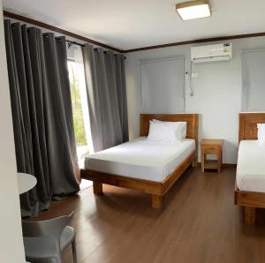 Postel nebo postele na pokoji v ubytování Villa Bella 3 Beach Resort