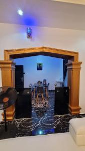 a living room with a table and a couch at Treasure Home 