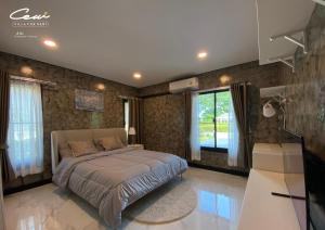 Postel nebo postele na pokoji v ubytování C6 Rock Garden Pool Villa พูลวิลล่า + 15 fotografií