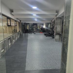 an empty room with a hallway with a gym at Gold Reef 1, Villas Bavaro, Punta Cana in Punta Cana