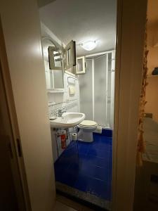 a bathroom with a sink and a toilet at Residence 10 Capotesta in Capo Testa