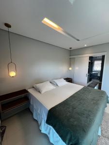a bedroom with a large bed in a room at Comfort Family Santarém access Alter do chão in Santarém