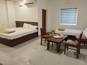 Ένα ή περισσότερα κρεβάτια σε δωμάτιο στο JP Tower