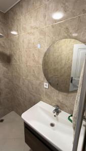 a bathroom with a sink and a mirror at Guba White House in Uçgün +28 photos