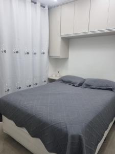 Ένα ή περισσότερα κρεβάτια σε δωμάτιο στο Studio Ipiranga Aconchego