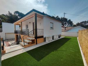 a house with a green lawn in front of it at Marca 34 in Monção