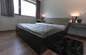 Postel nebo postele na pokoji v ubytování Villa Grey + 16 fotografií