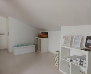 a white room with white shelves and a white wall at Joseph's house in Florence