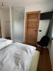 Postel nebo postele na pokoji v ubytování Cesa Pattis