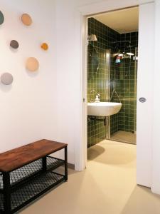 a bathroom with a sink and a shower and a table at San Mark's basin best view in Venice