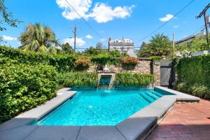 a swimming pool in the yard of a house at Mint Julep Estate in Savannah