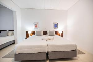 Ένα ή περισσότερα κρεβάτια σε δωμάτιο στο Aparthotel Barracuda