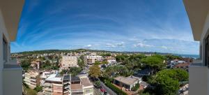 an aerial view of a city with trees and buildings at Riviera Suite - PRIVATE BEACH with sunbeds INCLUDED in June, July & August in Santa Marinella