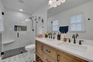 a white bathroom with a sink and a toilet at Relaxing Retreat Near North Hills & Downtown home in Millbrook +28 photos